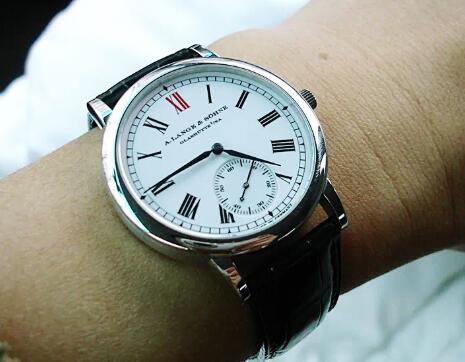 The red Roman numeral hour marker at 12 o'clock is striking on the fake A. Lange & Söhne.