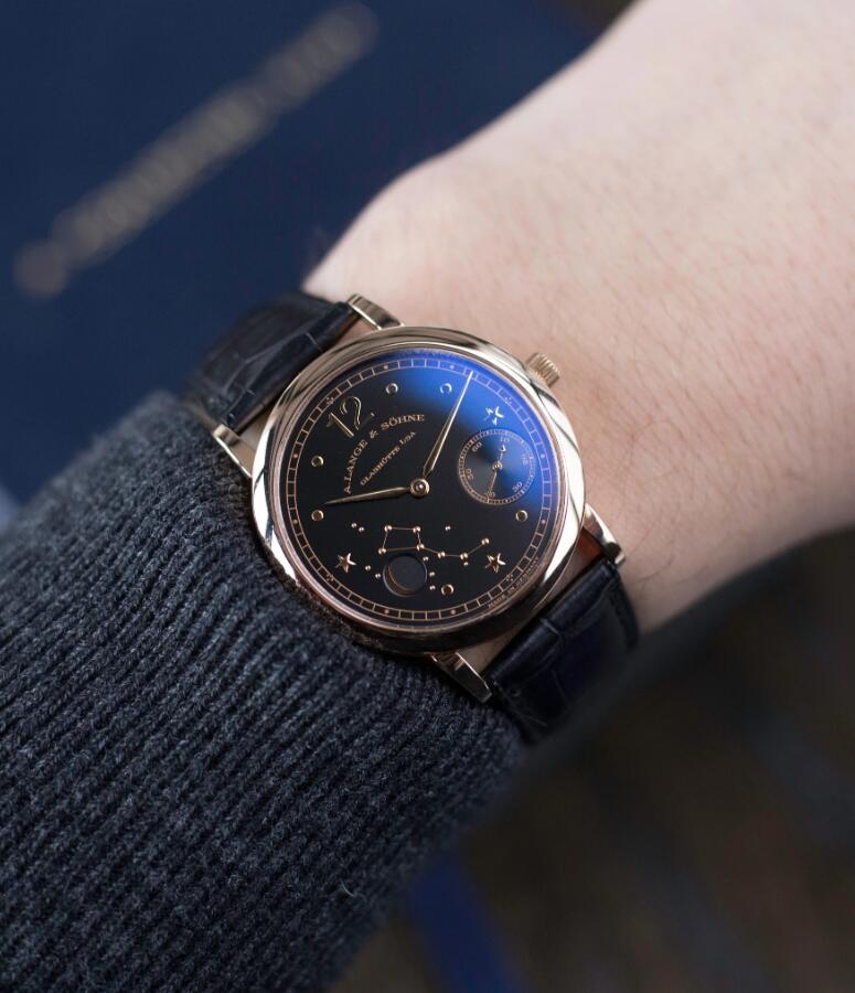 The 35.9mm fake watch features a moon phase.