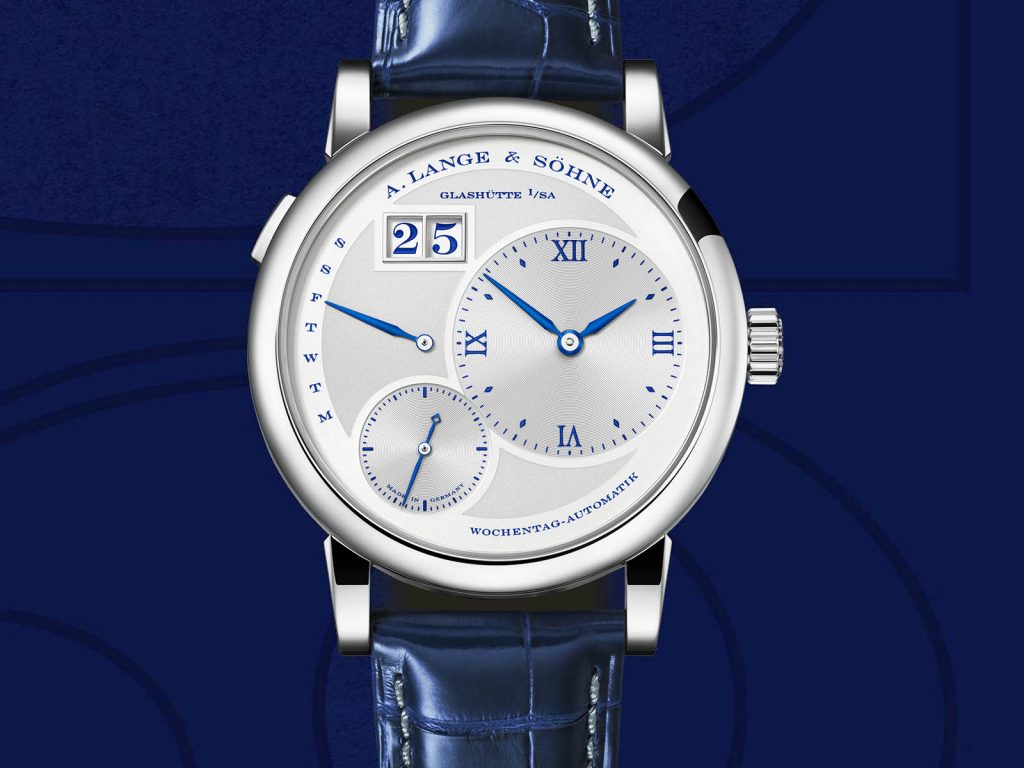 The 18k white gold fake watch has a blue strap.