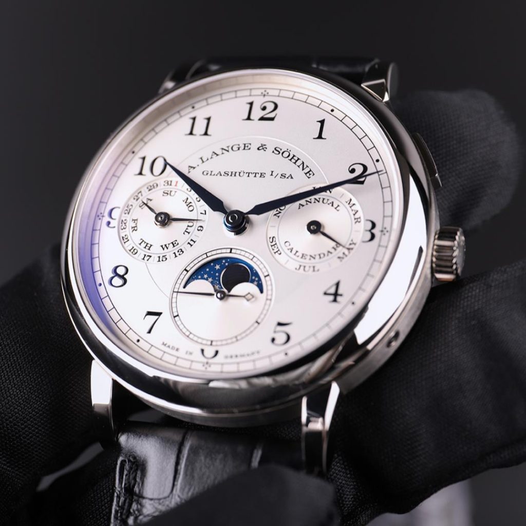 The silvery dial fake watch has moon phase.