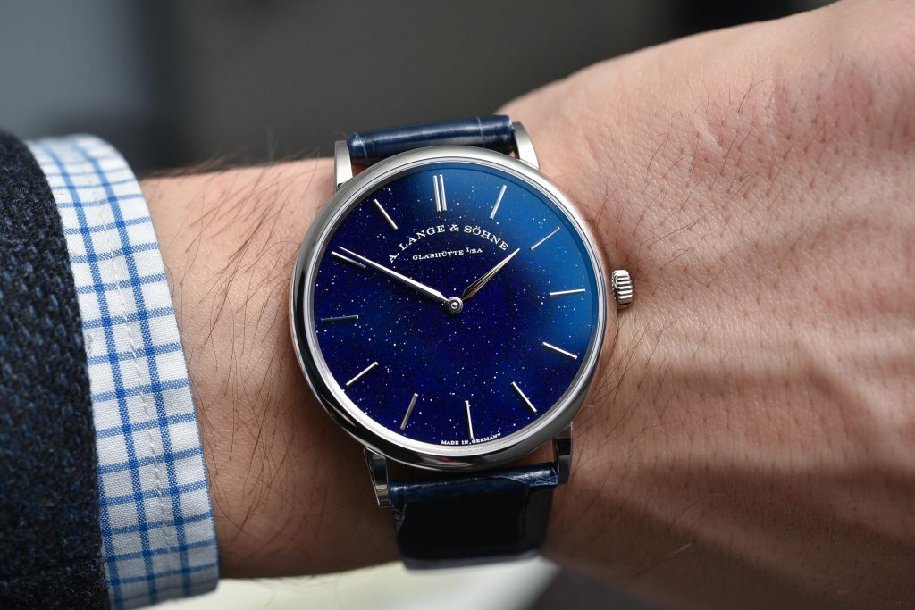 The blue dial fake watch has a blue strap.